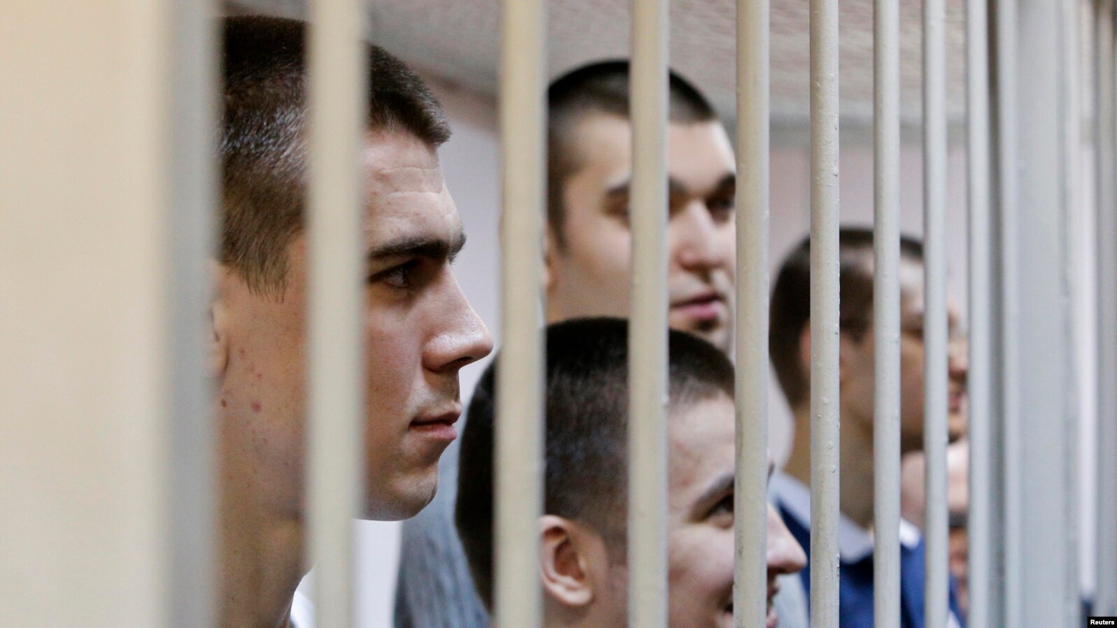 Defendants in the Bolotnaya case wait for their sentencing in a holding cell during a court hearing in Moscow on February 24.