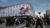 A billboard featuring an image of the late supreme leader, Ayatollah Ali Khamenei, in Tehran