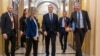 NATO Secretary General Jens Stoltenberg (center) walks through the U.S. Capitol between meetings with Republican and Democratic leaders to discuss the importance of renewing aid to Ukraine on January 30.