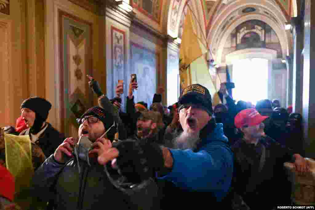 Supporters of U.S. President Donald Trump protest inside the U.S. Capitol on January 6, 2021, in Washington, D.C. (Photo by ROBERTO SCHMIDT / AFP)