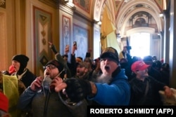 The pro-Trump mob inside the U.S. Capitol on January 6. Trump later told them to go home but did not condemn the violence and said, "We love you."