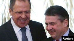 Russian Foreign Minister Sergei Lavrov (left) meets with German counterpart Sigmar Gabriel in Moscow on March 9. 