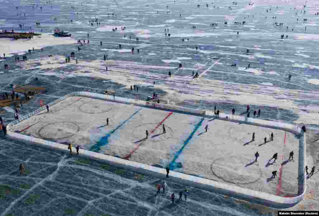 An aerial view shows a hockey rink after a match on the ice of Lake Baikal, which was organized to draw attention to environmental issues in Russia&#39;s Irkutsk region. (Reuters/Maksim Shemetov)
