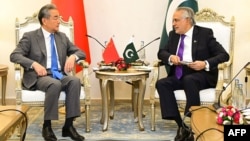 Pakistani Foreign Minister Ishaq Dar (right) speaks with his Chinese counterpart, Wang Yi, during a meeting in Islamabad in August 2025. 
