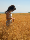 Moldova, Farmer Cristina Bejereanu in a wheat field, wheat