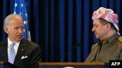 Kurdish region President Masud Barzani (right) and U.S. Vice President Joe Biden address a joint press conference in Irbil in 2009.