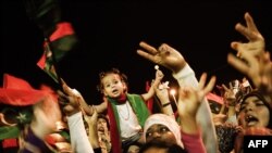 Spontaneous celebrations erupt on the streets of Benghazi after it is announced that Libyan rebels had overrun Muammar Qaddafi's compound in Tripoli. 