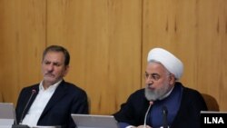 Iran - President Hassan Rouhani (R) and VP Es'haq Jahangiri in government cabinet meeting. August 14, 2019