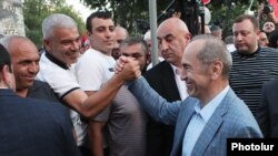 Armenia - Former President Robert Kocharian greets a supporter in Yerevan, May 28, 2021.