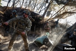Soldiers fire a M777 howitzer toward Russian troops in the Donetsk region on April 20.