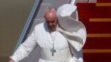 Pope Francis disembarks a plane as he arrives at Baghdad International Airport to start his historic tour in Baghdad, Iraq, March 5, 2021.