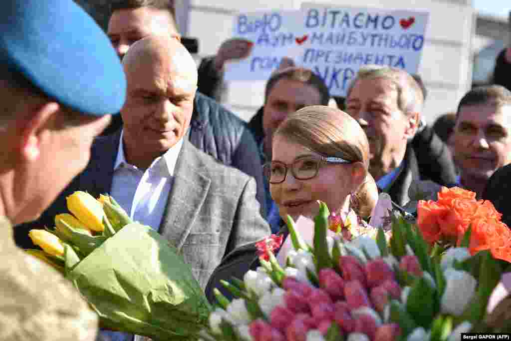 Former Ukrainian Prime Minister and presidential candidate Yulia Tymoshenko speaks with supporters outside a polling station after casting her ballot in Kyiv. (AFP / Sergei Gapon)