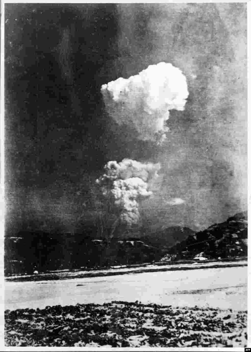 This black-and-white photo provided on January 9 by the Honkawa Elementary School in Hiroshima, Japan, shows the mushroom cloud from the Hiroshima atomic bombing split in two. It is believed to have been taken about 30 minutes after the bombing on August 6, 1945, from a location some 10 kilometers east of the blast. "The existence of this shot was always known in history books, but this is the first time that the actual print was discovered," said a curator at the Hiroshima Peace Memorial Museum. (AFP/Honkawa Elementary School)