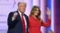 Former U.S. President and 2024 Republican presidential candidate Donald Trump raises a fist next to his wife, Melania, during the last day of the 2024 Republican National Convention in Milwaukee, Wisconsin, on July 18. 