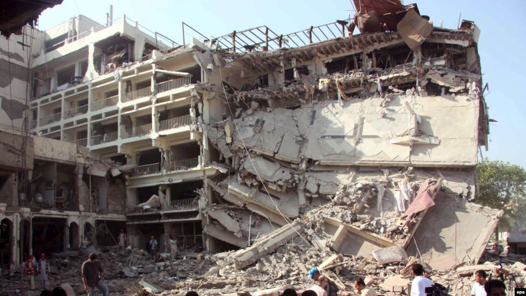 A large section of the Pearl Continental Hotel is in ruins after a suspected suicide bomb blast.
