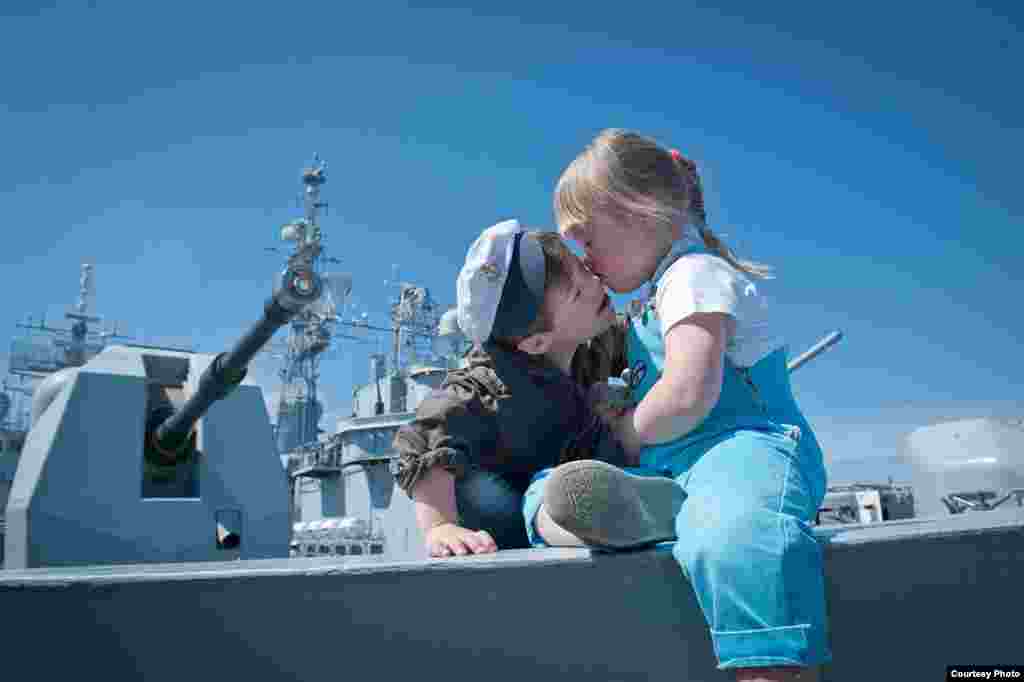 Children with Down syndrome participating in a special tour of the &quot;HMS York,&quot; a British Royal Navy vessel docked in St. Petersburg, in July 2012. The excursion was organized for children from city orphanages and special schools. 