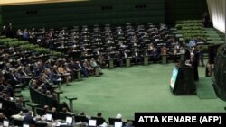 Iranian President Hassan Rohani (Right) speaks at parliament in Tehran on December 25, 2018 as he presents his government's 2019-2020 budget.