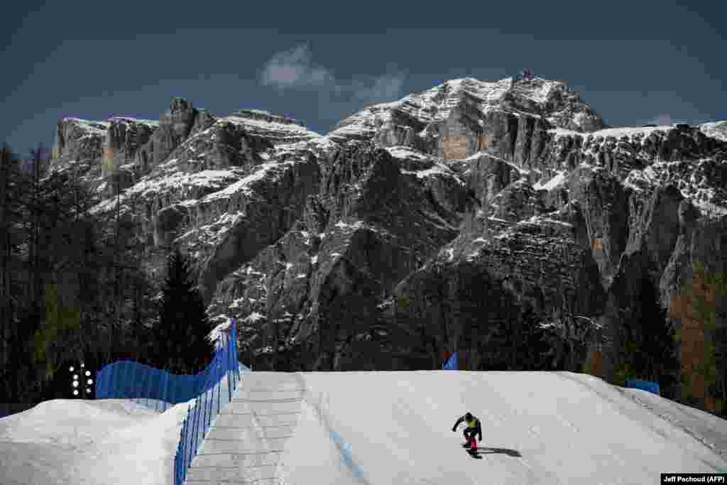 An unidentified rider competes during the snowboard cross event on March 8.Iran was scheduled to send one athlete to compete in the cross-country skiing event at the games, but the competitor was forced to withdraw amid travel safety concerns due to the ongoing war in Iran.