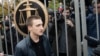 Russian actor Pavel Ustinov leaves court after his hearing in Moscow on September 30. 
