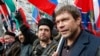 Russia – Pro-Russian politician Oleh Tsaryov (R) and leader of the motorcycling club Night Wolves Aleksandr Zaldostanov (C) attend an "Anti-Maidan" rally to protest against the 2014 Kyiv uprising, in Moscow February 21, 2015