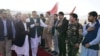 Afghan President Ashraf Ghani (in mask) arrives in Mazar-e Sharif to check the security situation of the northern provinces on August 11.
