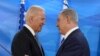 U.S. Vice President Joe Biden (L) shakes hands with Israeli Prime Minister Benjamin Netanyahu as they deliver joint statements during their meeting in Jerusalem on March 9, 2016.