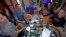 U.S. astronauts and Russian cosmonauts make pizza on the International Space Station.