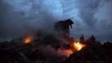 UKRAINE – People walking amongst the debris at the crash site of Malaysia Airlines Flight 17 near the village of Grabove, Donetsk region, July 17, 2014