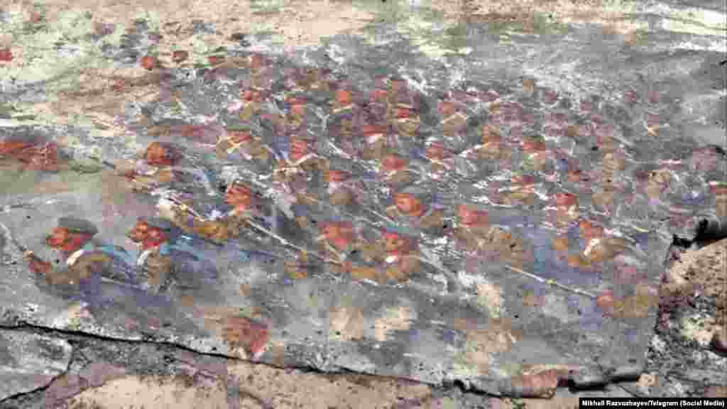 This fragment of the painting, filmed after its removal from the smoldering museum, matches a section of the panorama that has been preserved in online archives. 