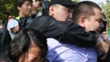 Kazakh law enforcement officers detain participants at an opposition rally in Almaty on September 21.