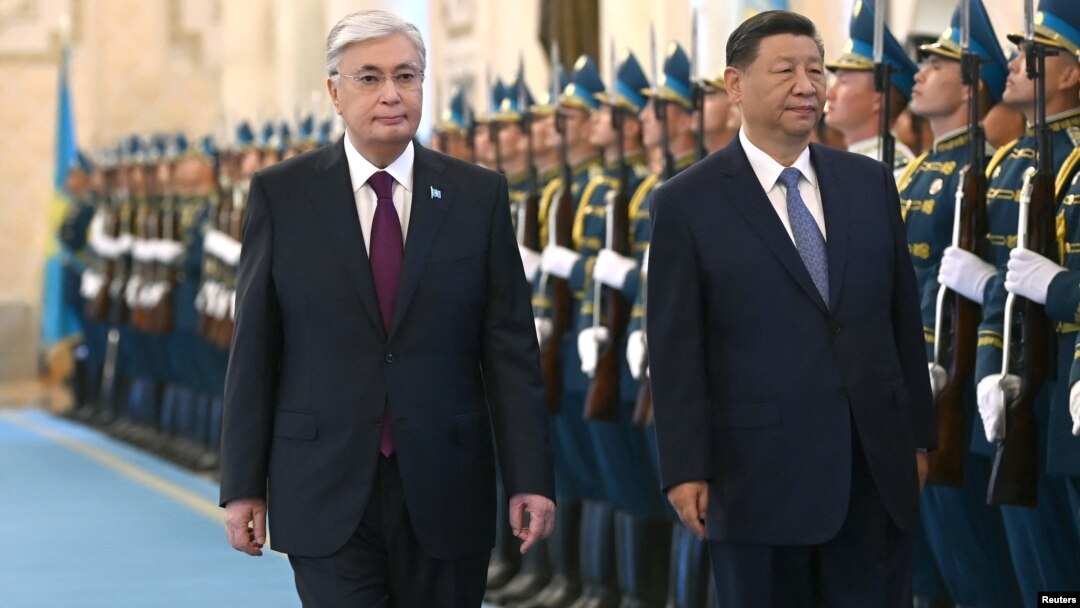 Kazakh President Qasym-Zhomart Toqaev (left) welcomes Chinese leader Xi Jinping to Astana on July 2 for a state visit and two-day SCO summit. 