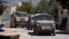 Vehicule blindate ale armatei israeliene intră în orașul palestinian Jenin în timpul unei operațiuni militare în nordul Cisiordaniei ocupate, pe 21 mai 2025.