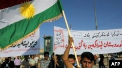 Kurds wave their flag during a demonstration against Turkey in Kirkuk.