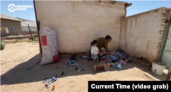 Dilfuza Hayitova earns about $2.50 a day selling empty cans and plastic bottles.