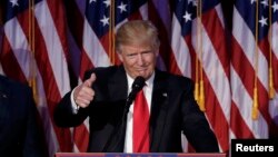 U.S. -- U.S. President-elect Donald Trump greets supporters during his election night rally in Manhattan, New York, U.S., November 9, 2016. 