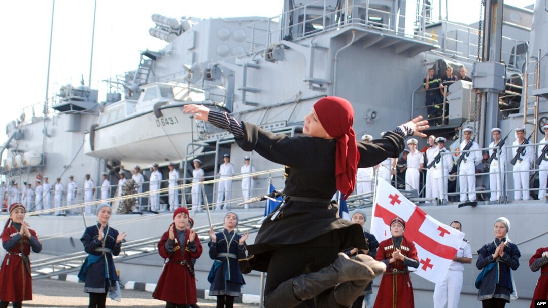 Georgian children in traditional clothing perform during a welcoming ceremony for the French antisubmarine frigate "Jean de Vienne" in Batumi.