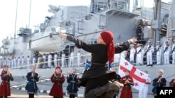 Georgian children in traditional clothing perform during a welcoming ceremony for the French antisubmarine frigate "Jean de Vienne" in Batumi.