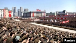 North Koreans attend a rally in support of leader Kim Jong Un's order to put its missile units on standby in preparation for a possible war against the United States and South Korea in Pyongyang on March 29.