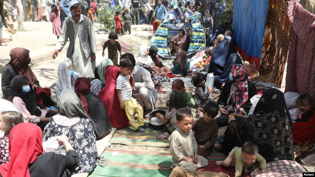 Internally displaced families from northern provinces who fled due to the fighting between the Taliban and Afghan security forces take shelter in a public park in Kabul.