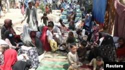 Internally displaced families from northern provinces who fled due to the fighting between the Taliban and Afghan security forces take shelter in a public park in Kabul.