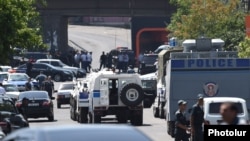 Armenia - Police vehicles block a road leading a police station in Yerevan seized by radical opposition activists, 17Jul2016.