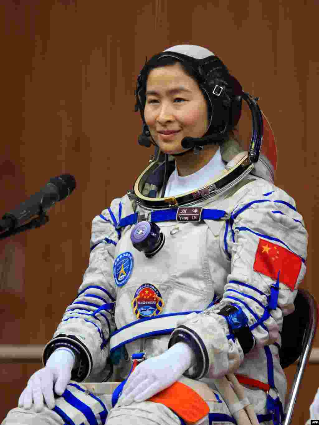 Liu Yang in her spacesuit posing for an official photo at the Jiuquan space base on June 12.