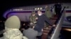 ARMENIA -- A freed Armenian captive is escorted off a Russian military plane upon arrival at a military airport outside Yerevan, December 14, 2020