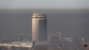 KAZAKHSTAN -- Cable cars are seen against the backdrop of the smog-shrouded city of Almaty, December 3, 2020