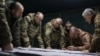 Colonel General Oleksandr Syrskiy (2nd left) and Defense Minister Rustem Umerov (left) visit frontline positions at an undisclosed location in eastern Ukraine on February 14. 