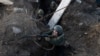 Civilians participate in trench warfare training during a Test Week organized by the 3rd Assault Brigade in Kyiv on January 30.