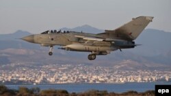 A handout picture provided by the British Ministry of Defense shows a Royal Air Force (RAF) Tornado GR4 returning from an armed mission in support of operation "Shader" in Iraq, to the RAF station in Akrotiri, Cyprus, on September 30.