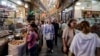 People walk along an alley of Tehran's Tajrish Bazaar on June 2. The prices of staple food items and medicines have skyrocketed since the start of the US-Israeli war with Iran. 