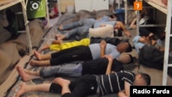 A frame grab from the hacked video shows an overcrowded cell in Evin prison with inmates sleeping on the floor.