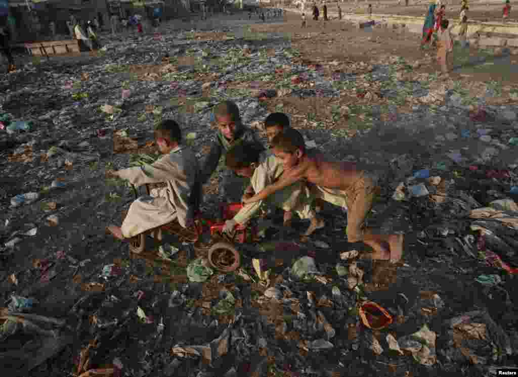 Children play in a slum area of Karachi, Pakistan.